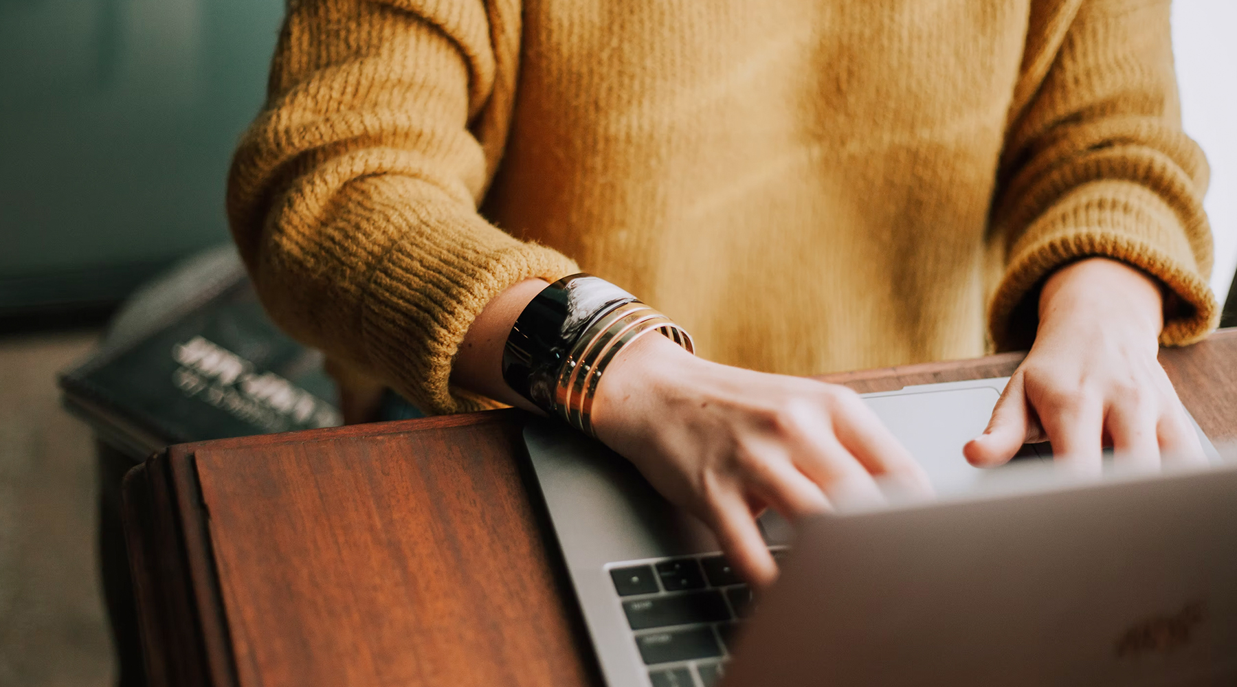 Close up of person typing on laptop