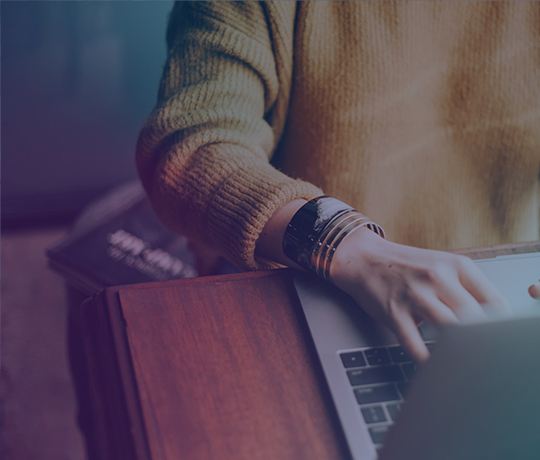 Close up of person typing on laptop
