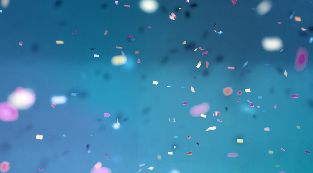 Multi-colored confetti on blue background