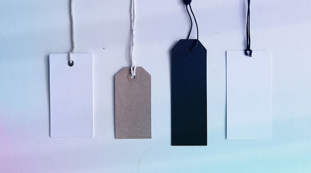 Various types of product tags laid out in a line