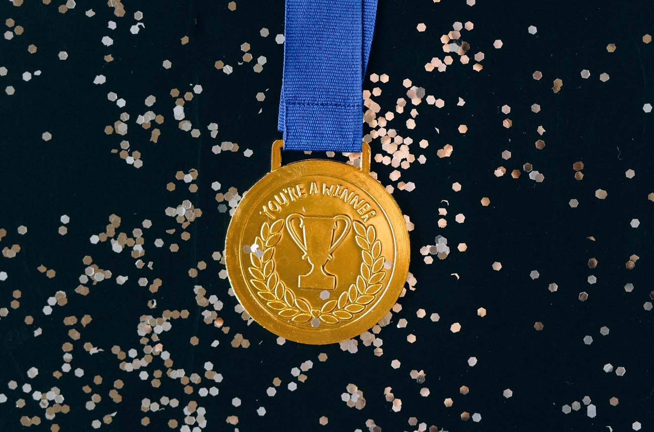 Award with glitter around it.
