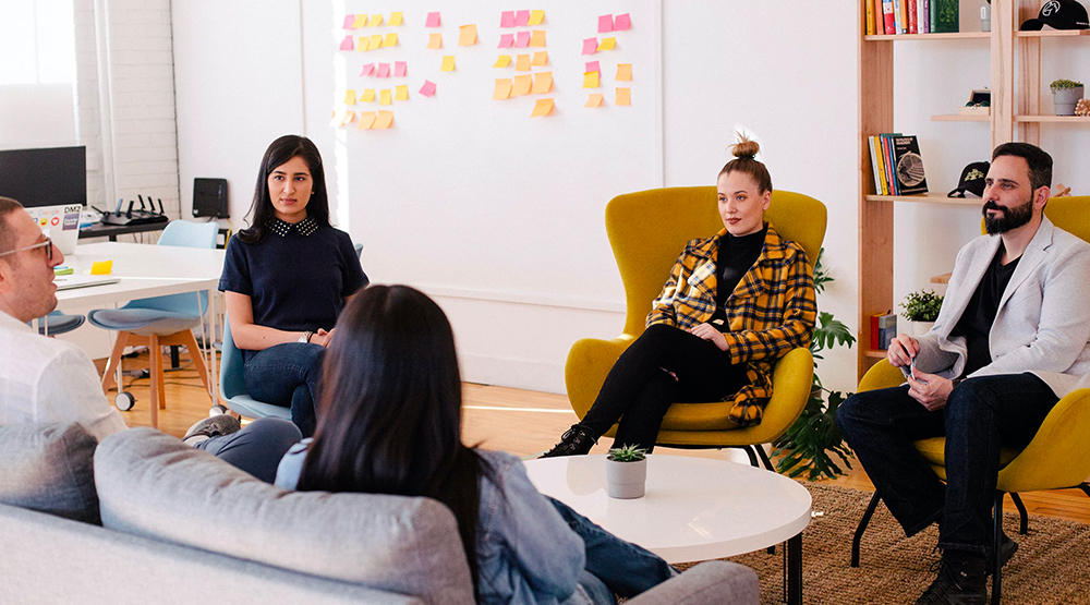 People sitting around a table brainstorming