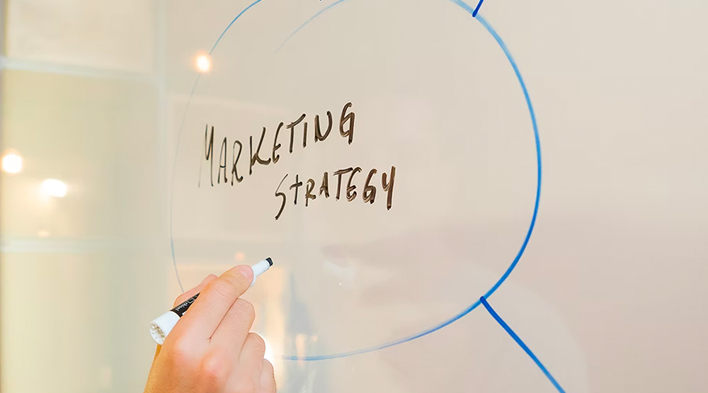 Close up of whiteboard with "email marketing" written and circled
