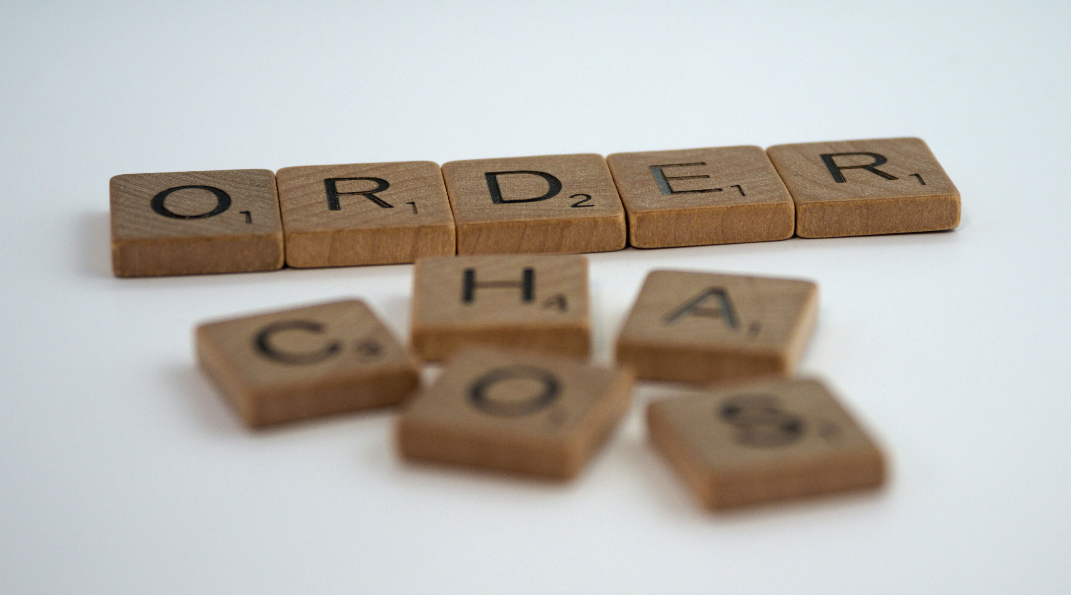 Scrabble tiles forming the words Order and Chaos