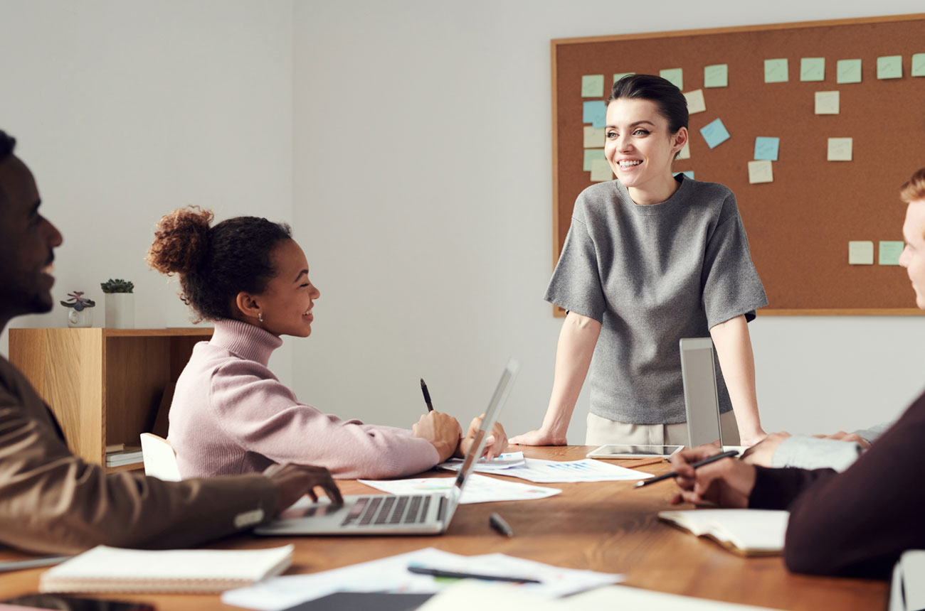 Woman leading a meeting with three co-workers