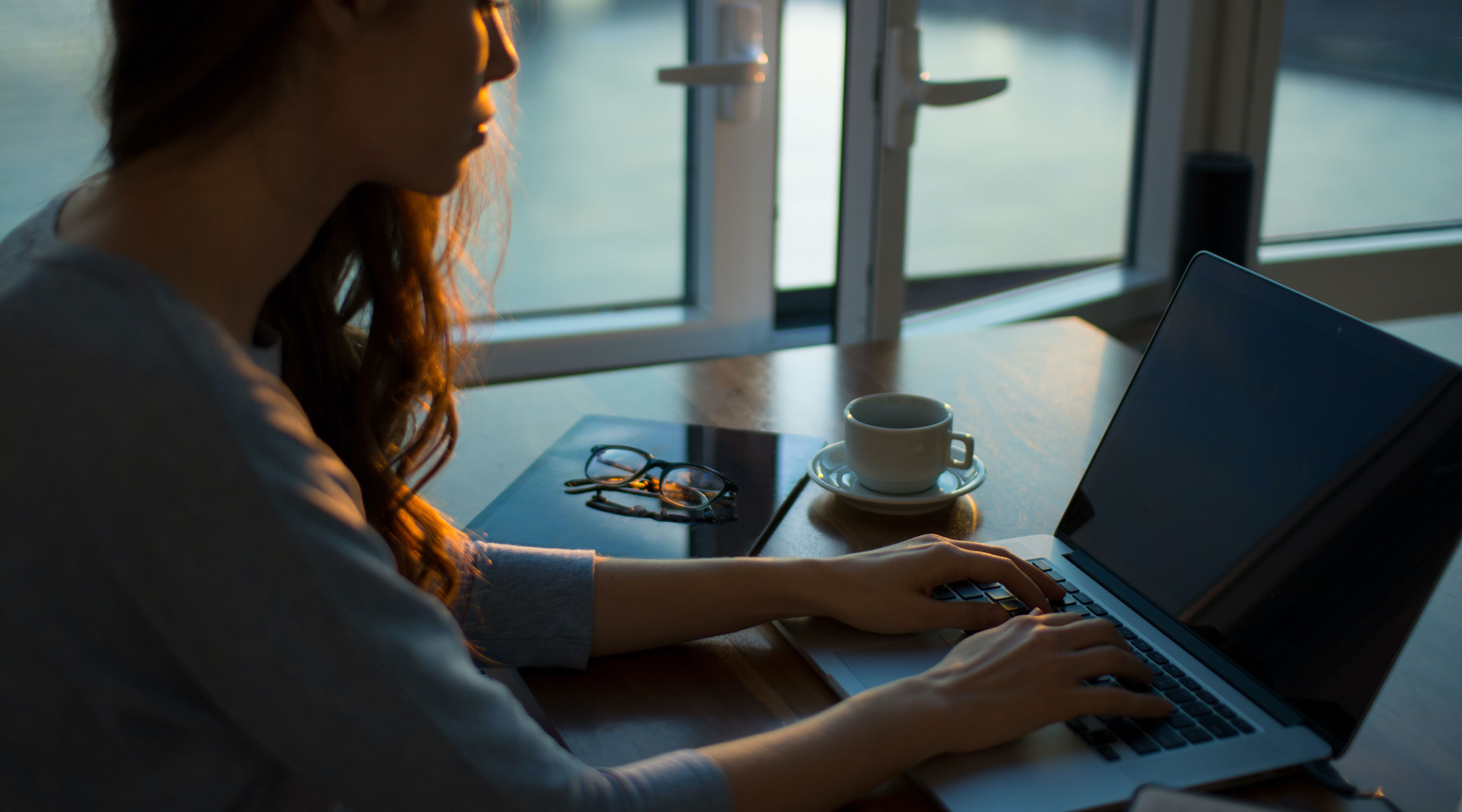 Woman typing on laptop